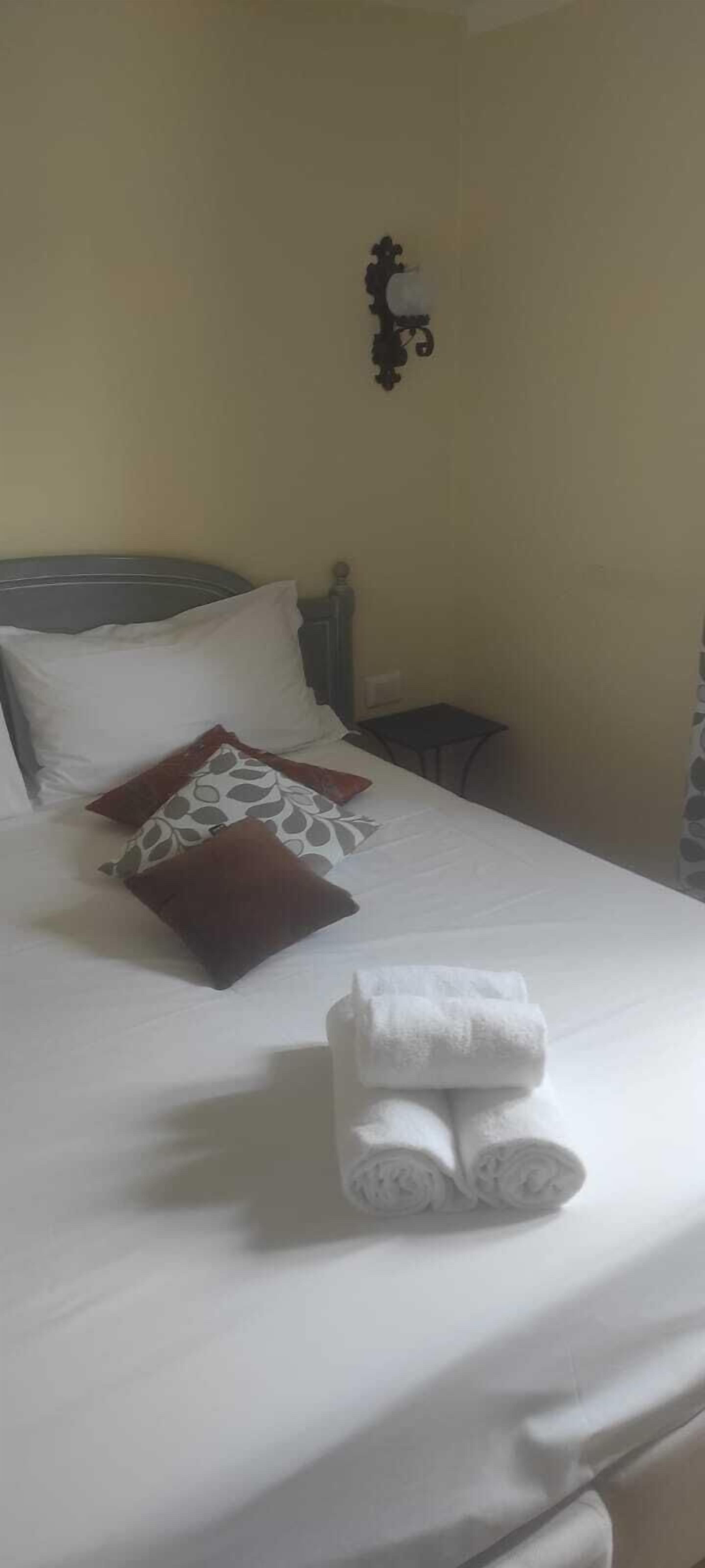 Economy Double Room, Private Bathroom (External) | Hypo-allergenic bedding, in-room safe, free WiFi, bed sheets