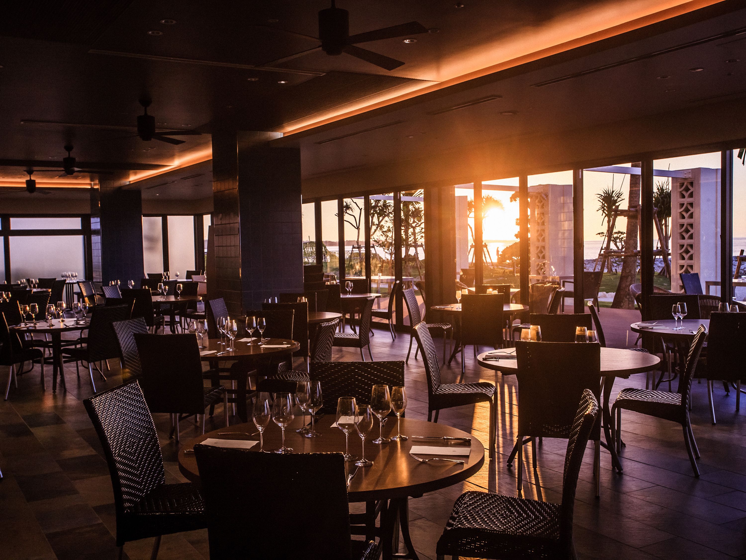 A restaurant with tables and chairs arranged for dining.