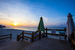 On the beach, sun loungers, beach umbrellas, fishing