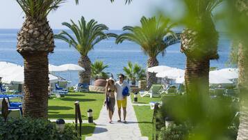 On the beach, sun-loungers, beach umbrellas, beach towels
