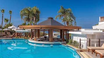 Indoor pool, outdoor pool, pool umbrellas, pool loungers