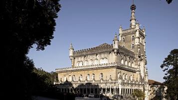 A historic building with ornate architecture, featuring multiple towers and arched windows.