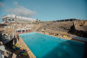 Seasonal outdoor pool, pool loungers
