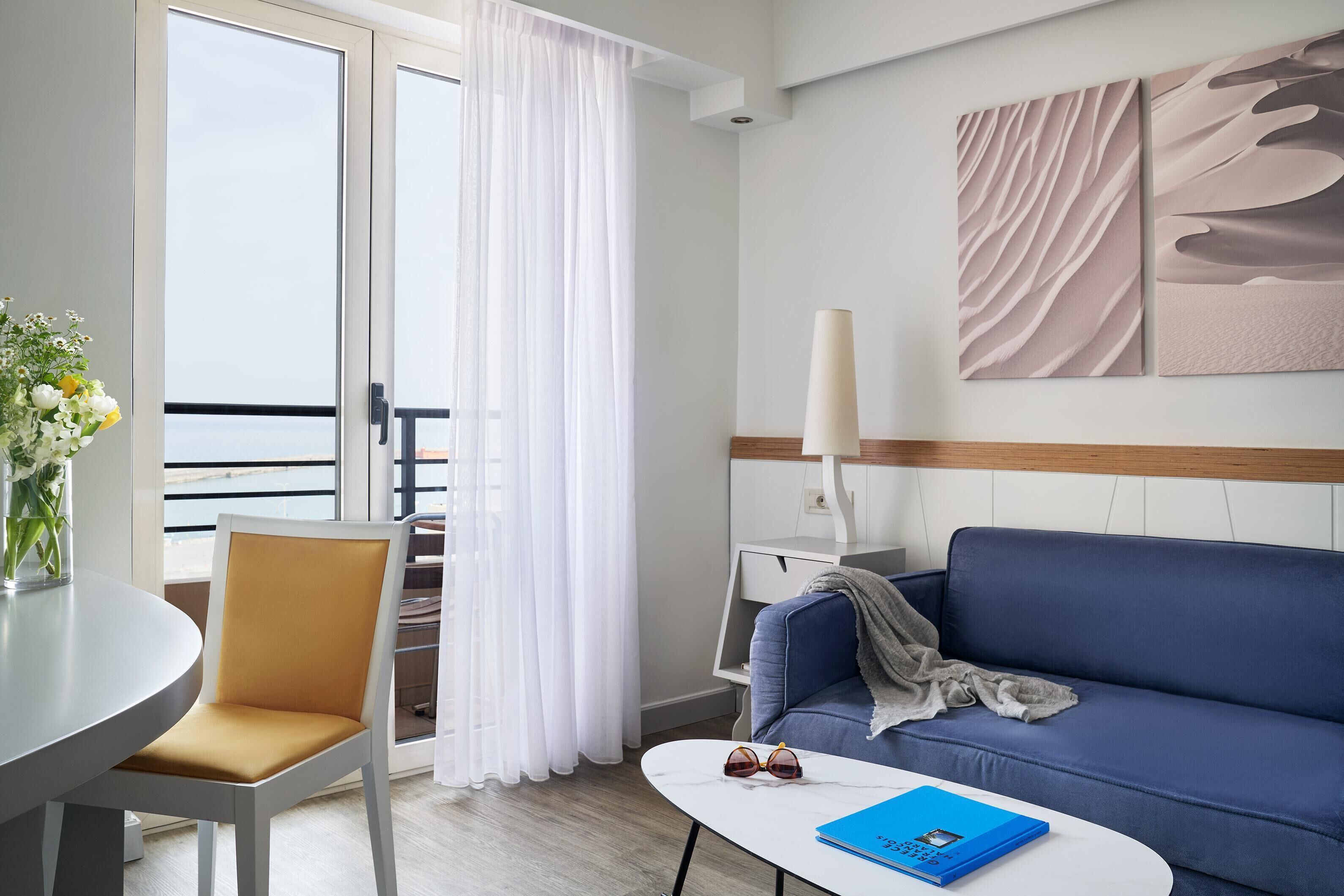 Junior Suite, Sea View | Minibar, in-room safe, laptop workspace, soundproofing