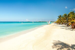 On the beach, white sand, sun-loungers, beach towels - Couples Swept Away All Inclusive (Negril)