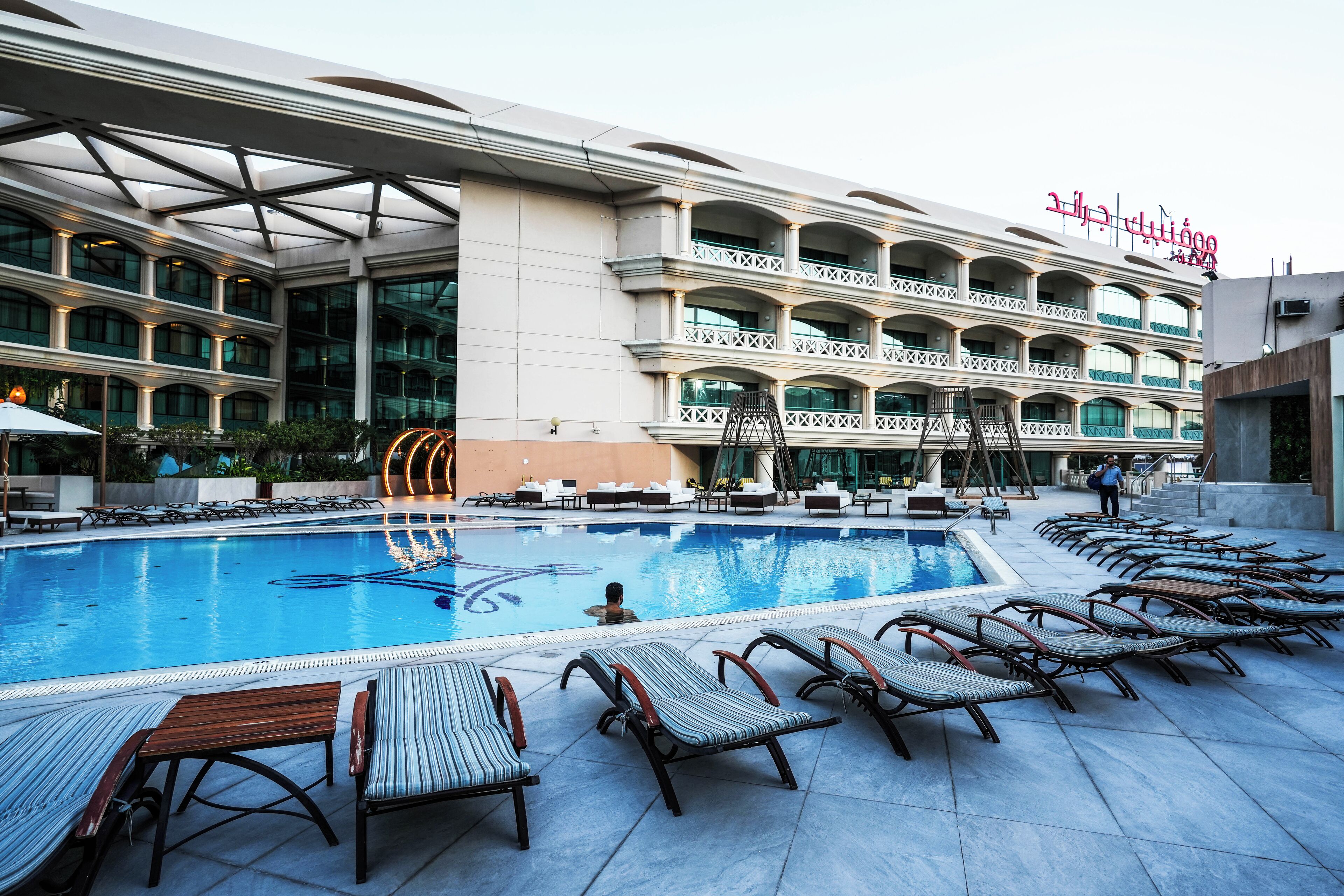 outdoor pool, pool umbrellas, pool loungers