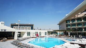 Outdoor pool, pool umbrellas, sun loungers