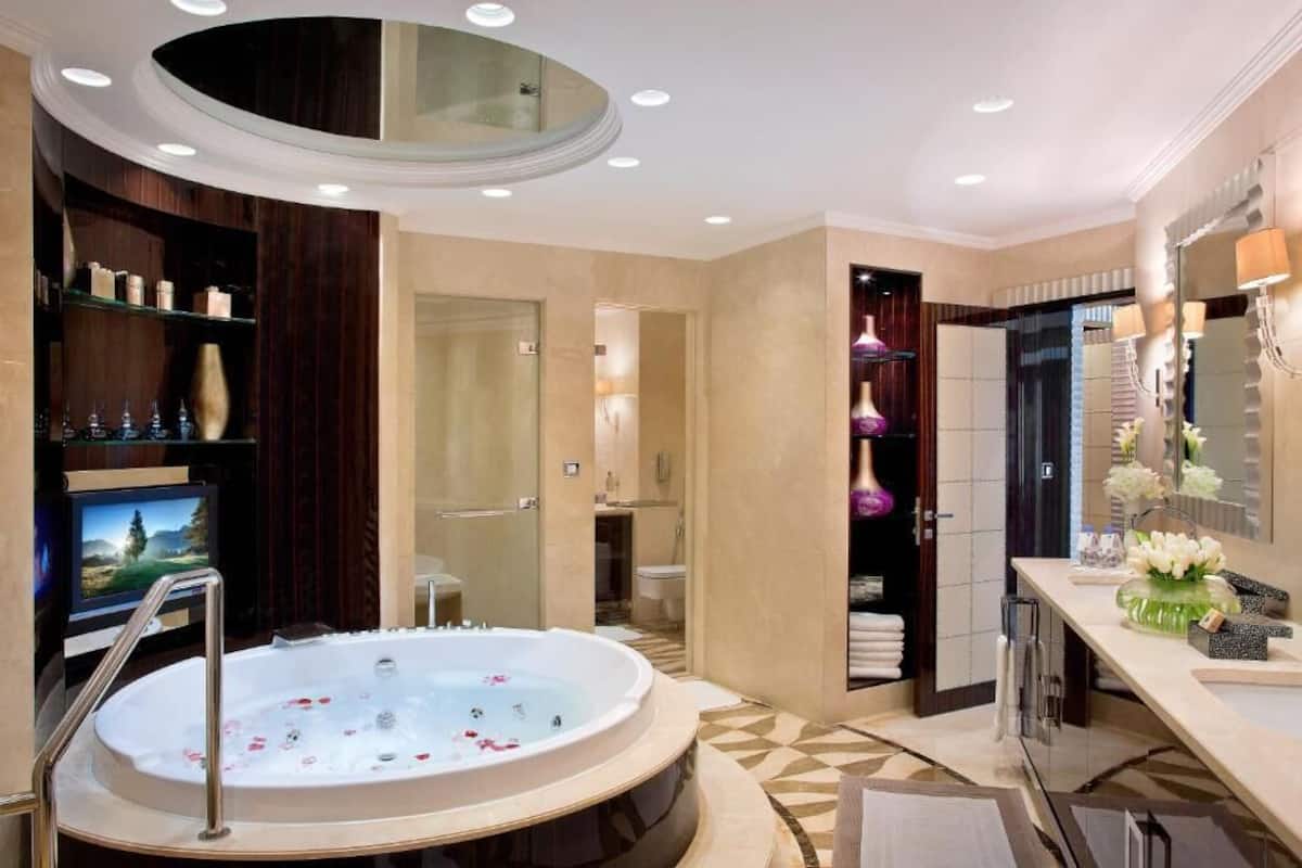 presidential suite, 1 king bed | bathroom | bathtub, eco-friendly toiletries, hair dryer, slippers