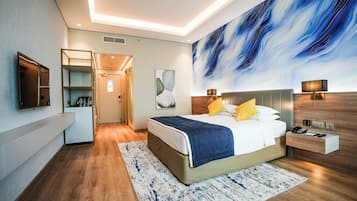 Premium bedding, down comforters, minibar, in-room safe