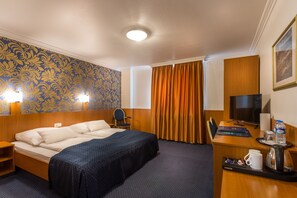 Luxe beddengoed, pillowtop-bedden, een minibar, een kluis op de kamer