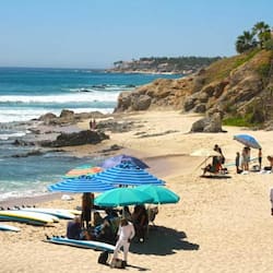 On the beach, white sand, sun loungers, beach umbrellas