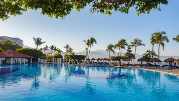 Outdoor pool, open 8:00 AM to 8:00 PM, pool umbrellas, pool loungers