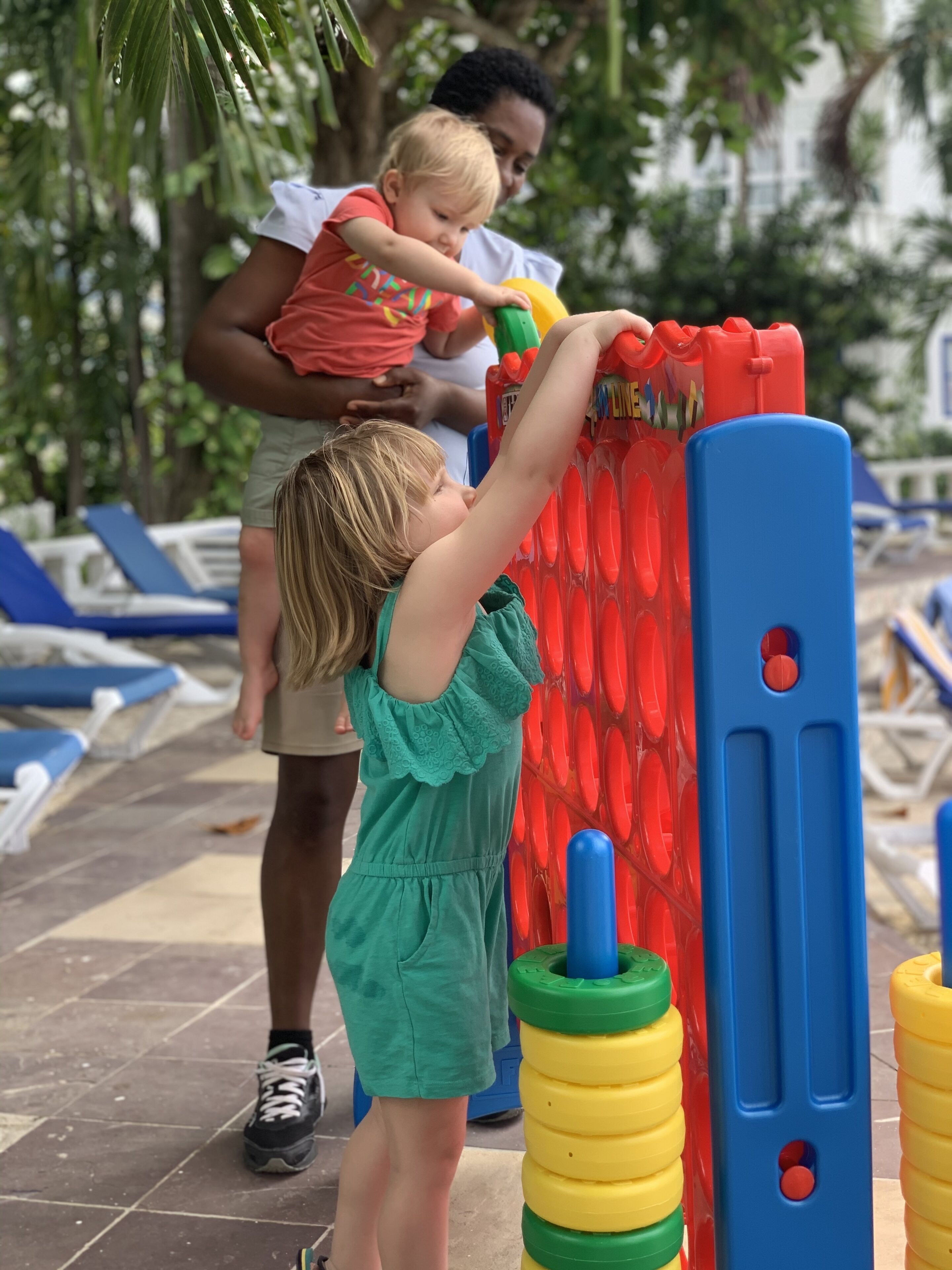 A child playing with a colorful play structure.