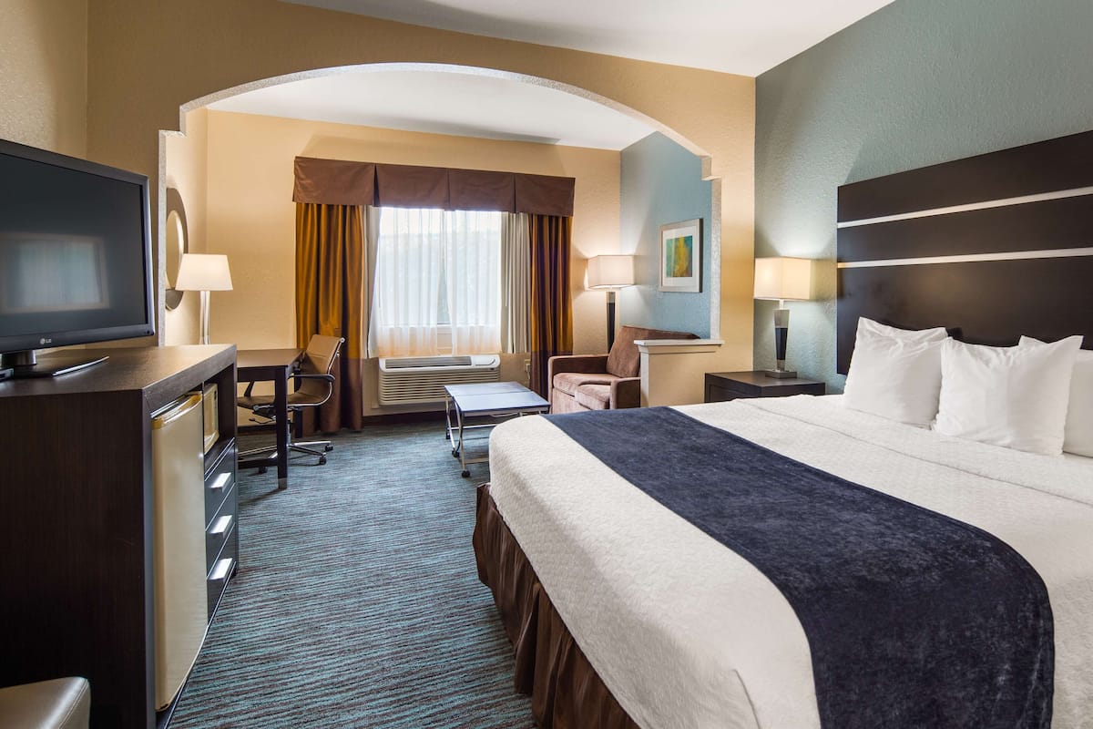 Premium bedding, desk, laptop workspace, iron/ironing board