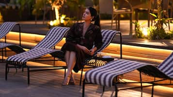 Seasonal outdoor pool, open 9:00 AM to 7:00 PM, sun loungers