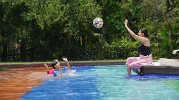 Seasonal outdoor pool, open 9:00 AM to 7:00 PM, sun loungers