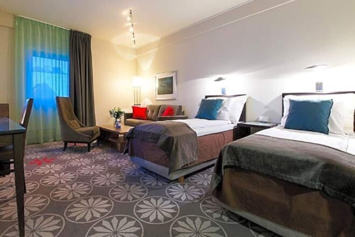 Desk, laptop workspace, iron/ironing board, cribs/infant beds