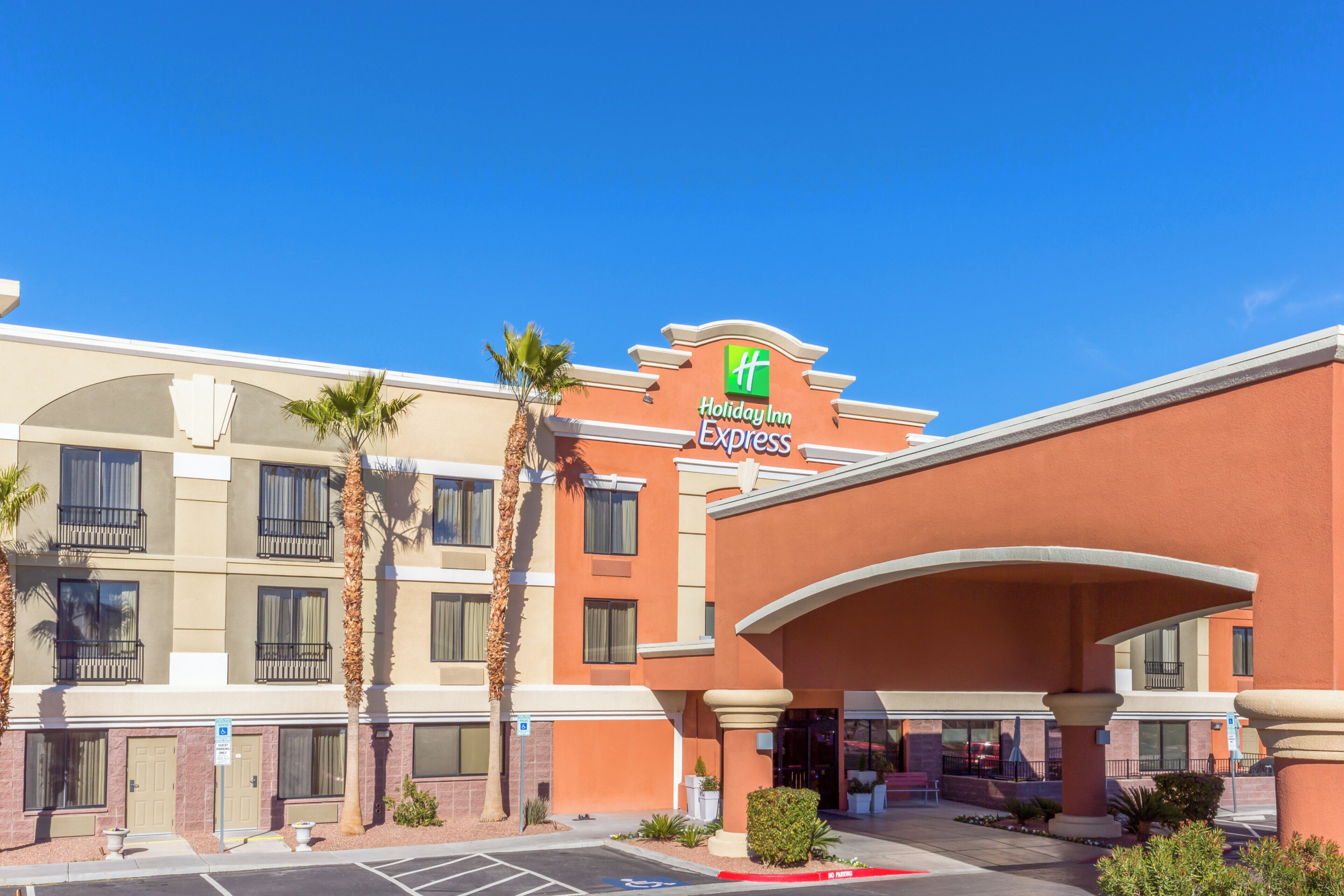 A Holiday Inn Express building with a clear blue sky.