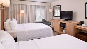 A hotel room with two beds, a desk with a television, a chair, and a minibar. - Hampton Inn Tulsa-Sand Springs (Tulsa)