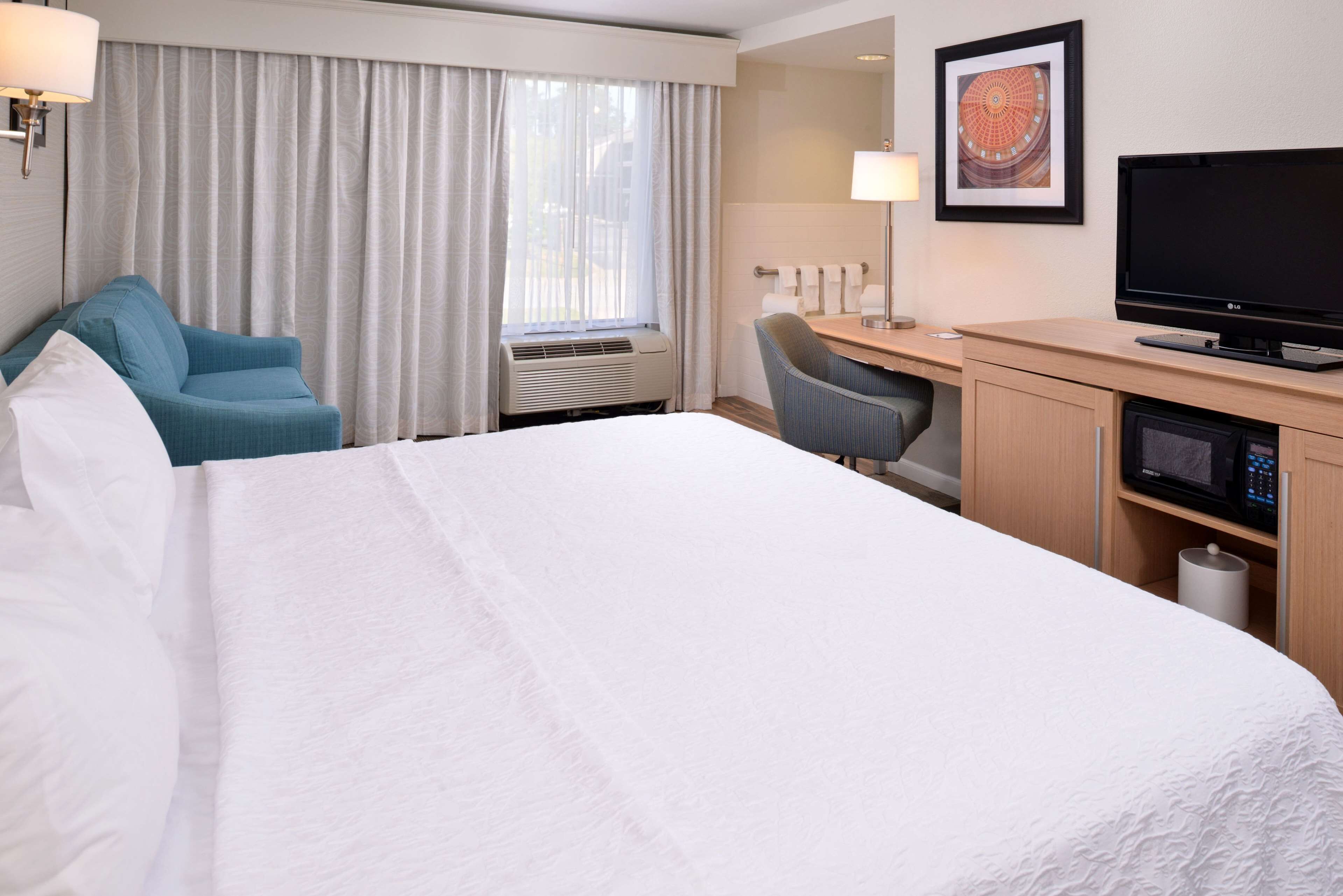 room, 1 king bed, jetted tub | premium bedding, desk, iron/ironing board, free wifi