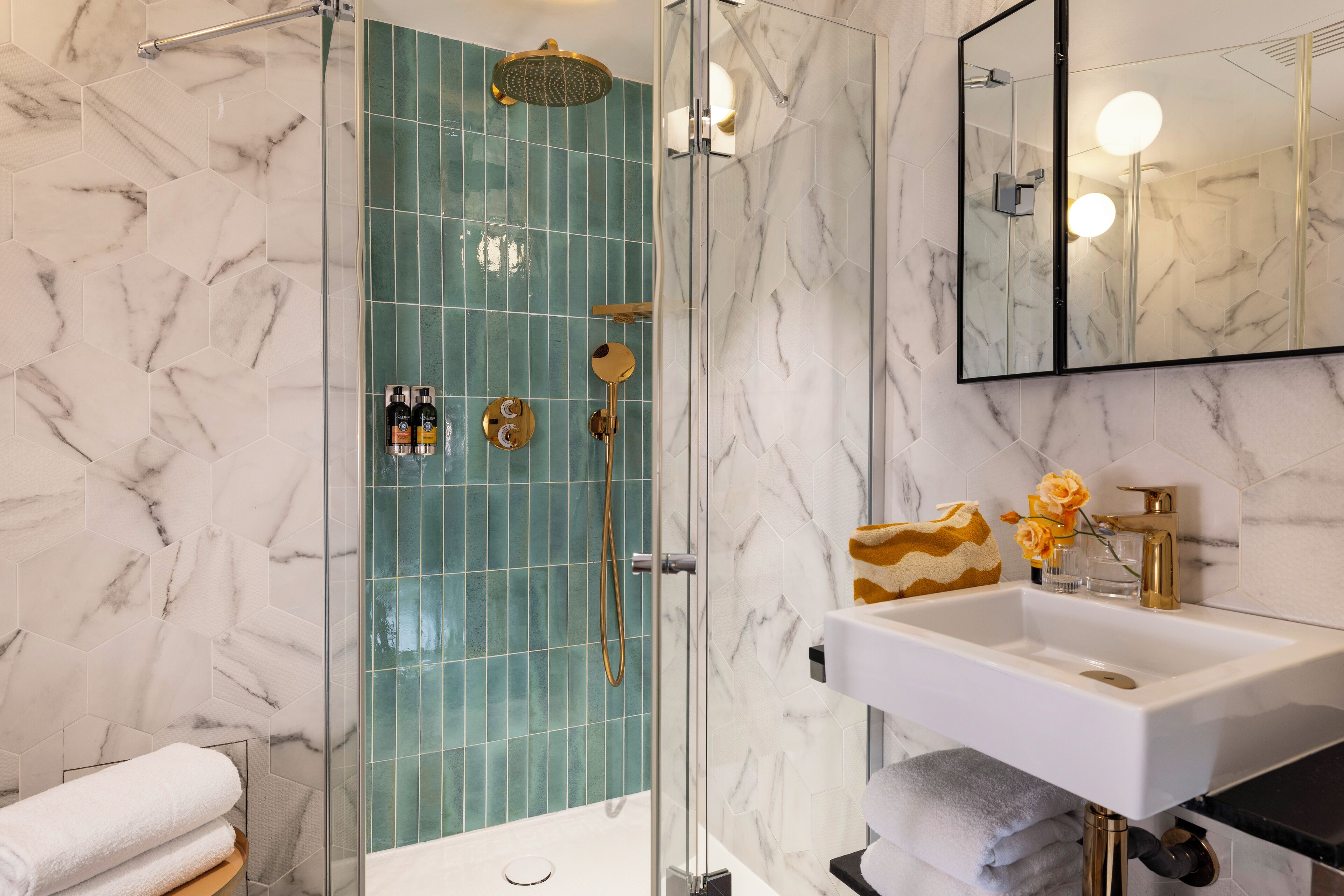 junior suite | bathroom | shower, designer toiletries, hair dryer, towels