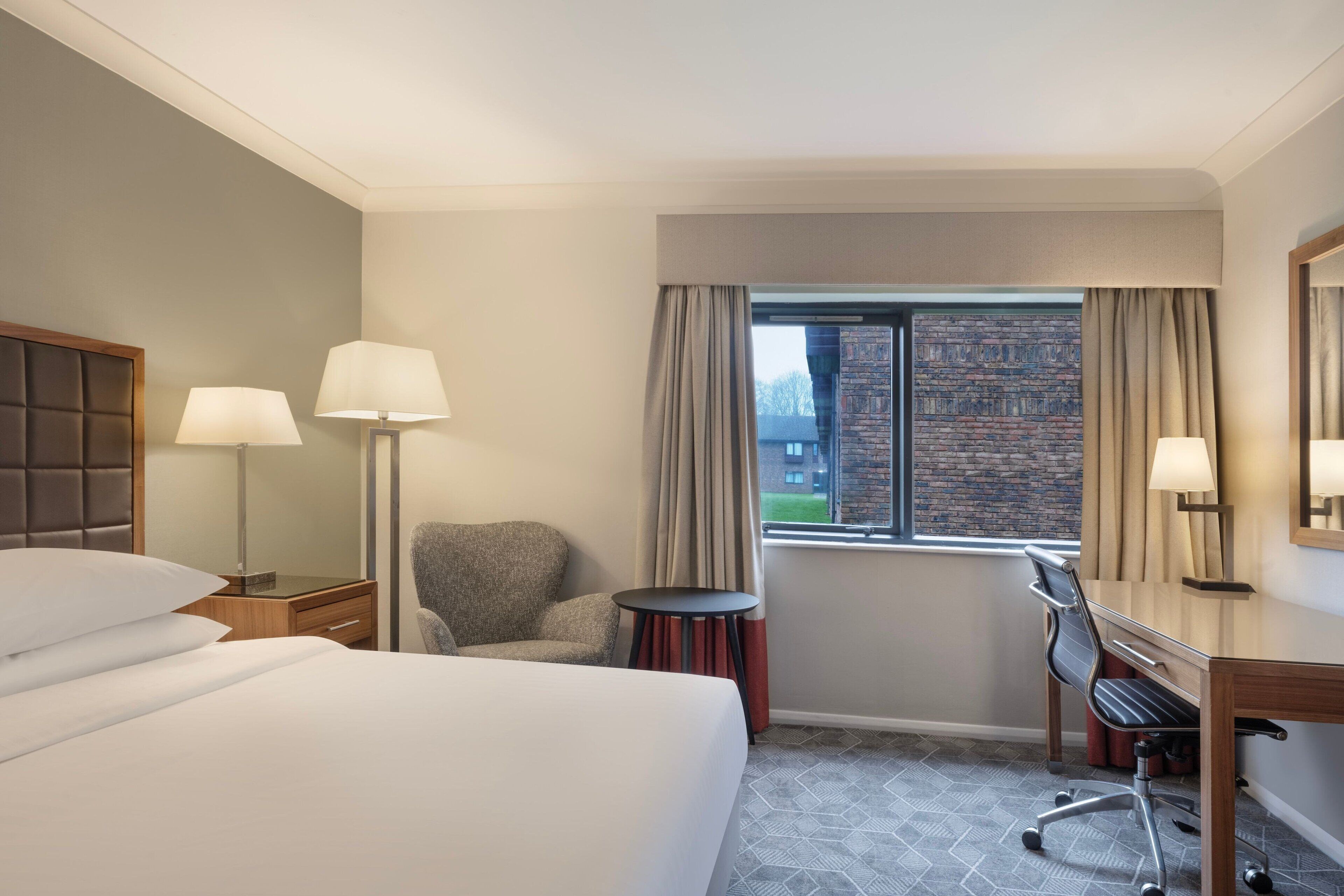 premium room, 1 king bed, non smoking | premium bedding, down duvets, select comfort beds, in-room safe