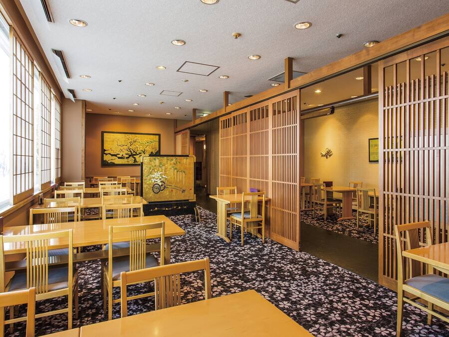 A traditional Japanese-style restaurant with wooden furniture and tatami mats.