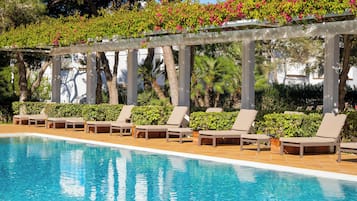 Indoor pool, seasonal outdoor pool, pool umbrellas, pool loungers