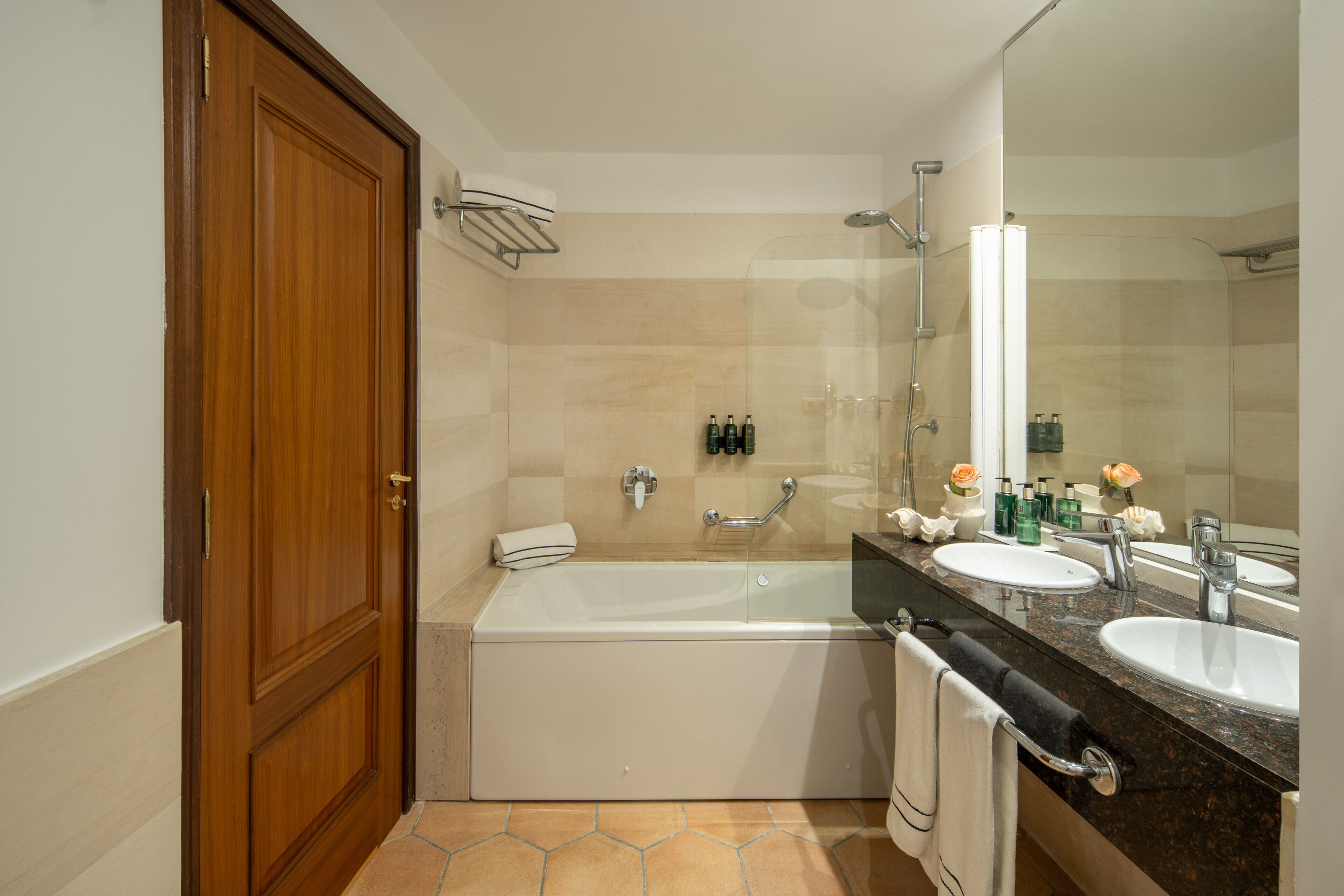 designer toiletries, hair dryer, bidet, towels