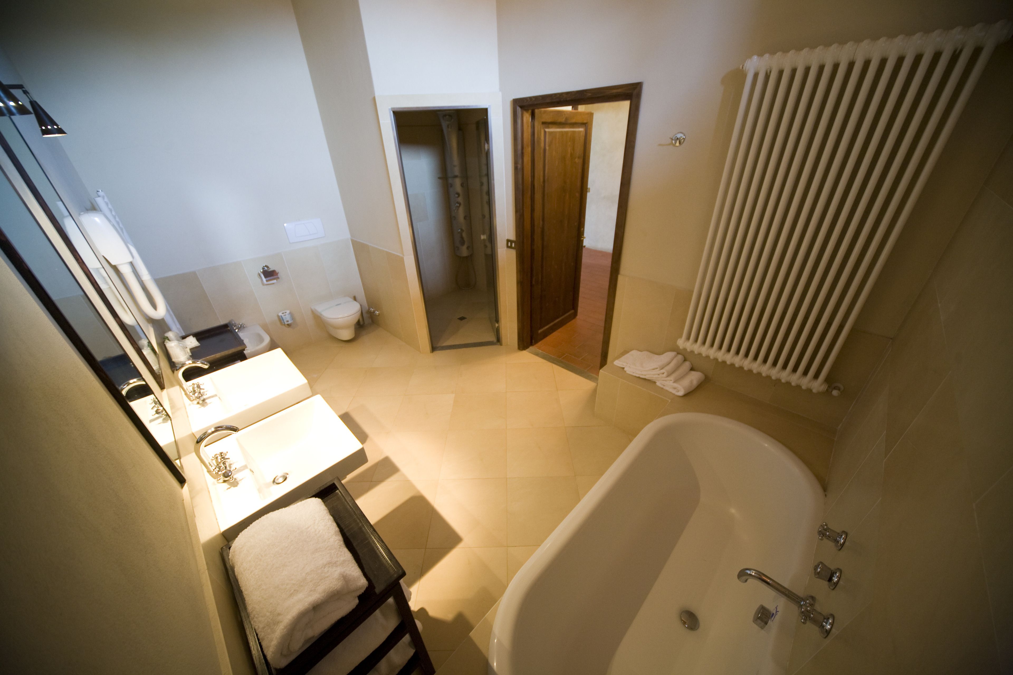 A bathroom with a bathtub, a sink, and a toilet.