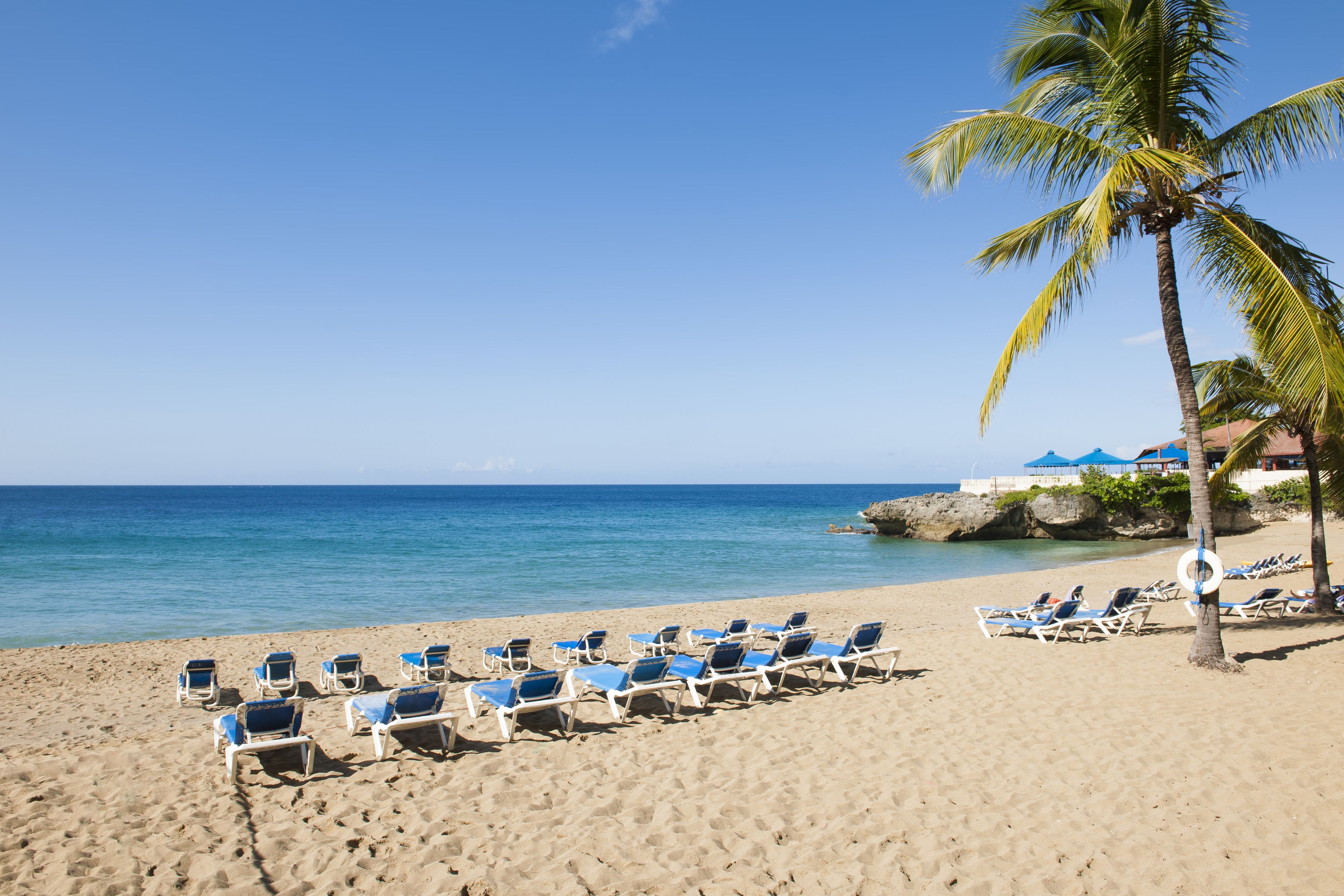 On the beach, sun loungers, beach towels