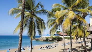 On the beach, sun-loungers, beach towels