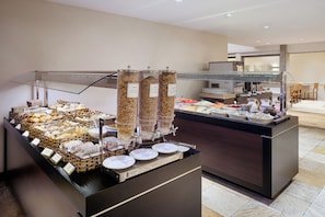 A buffet setup with various food items and a coffee station. - Savoy Othon Lite (Rio de Janeiro)