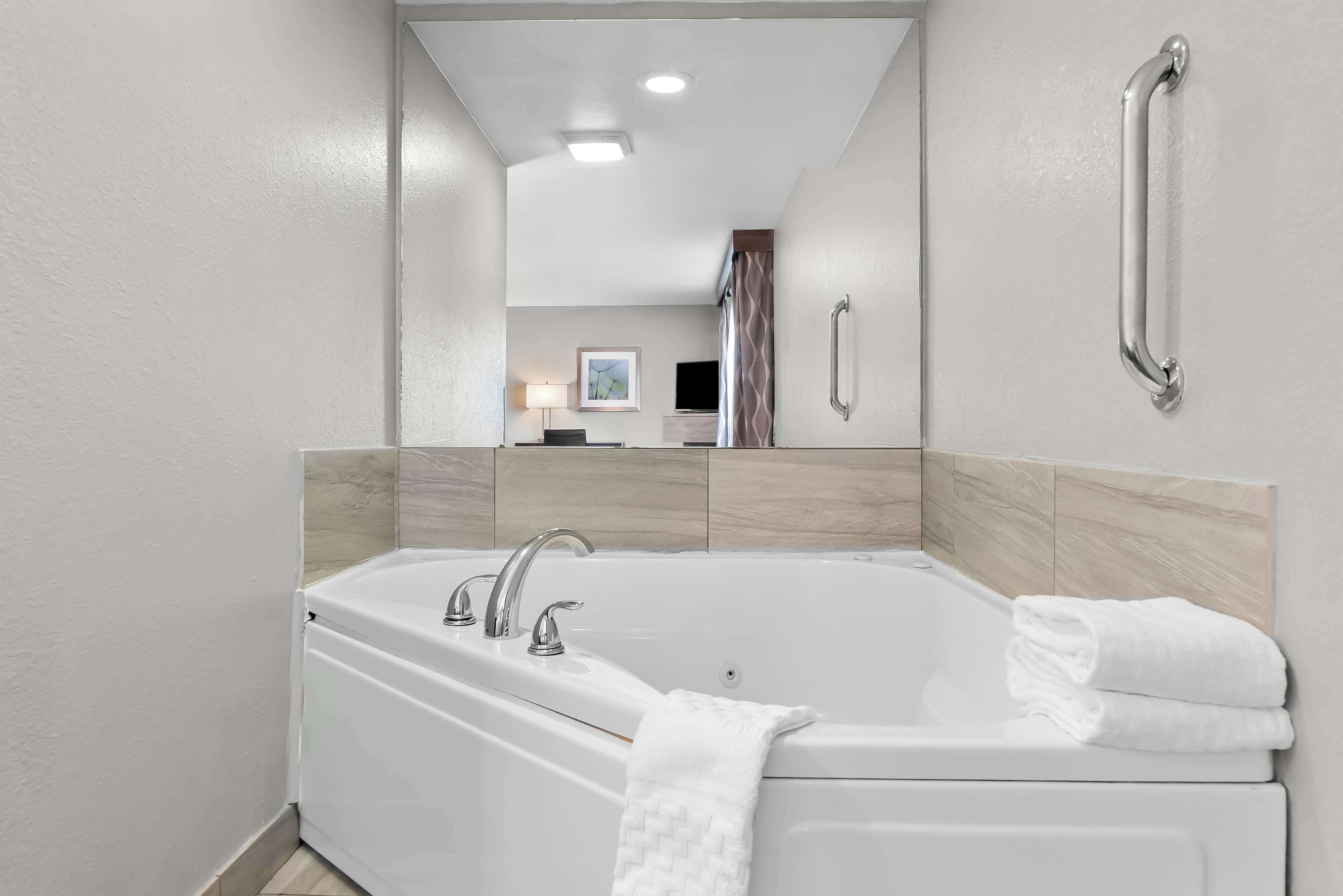 suite, 1 king bed, non smoking, jetted tub (with sofabed) | laptop workspace, iron/ironing board, free cots/infant beds