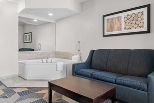 Suite, 1 King Bed, Non Smoking, Jetted Tub (Jetted Tub) | Laptop workspace, iron/ironing board, free cribs/infant beds