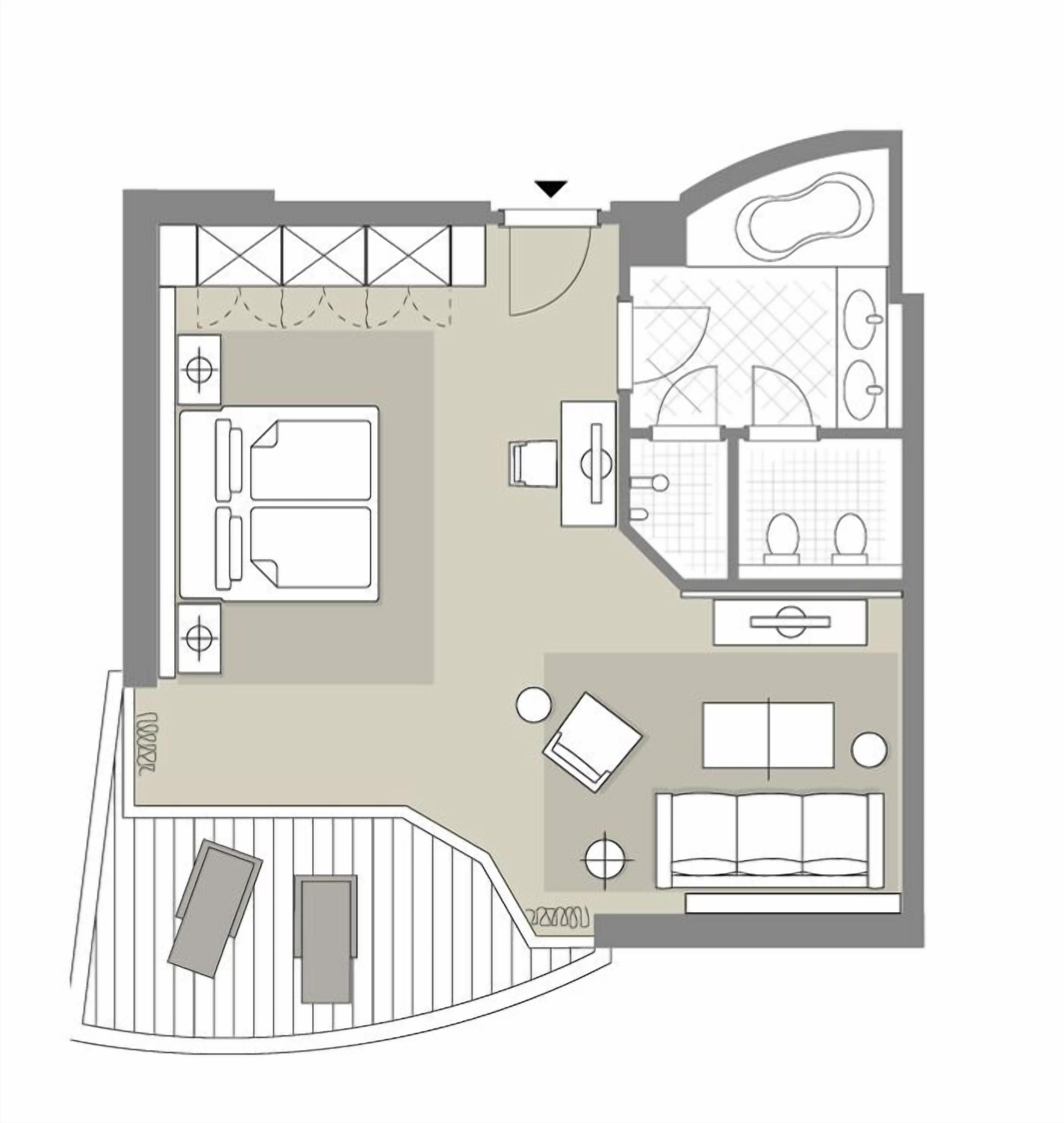 A floor plan of a hotel room with a bed, a desk, a chair, a small table, a sofa, a bathroom with a toilet and sink, and a shower area.