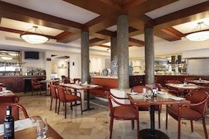 Enjoy a stylish dining experience with a variety of seating options and a selection of beverages.