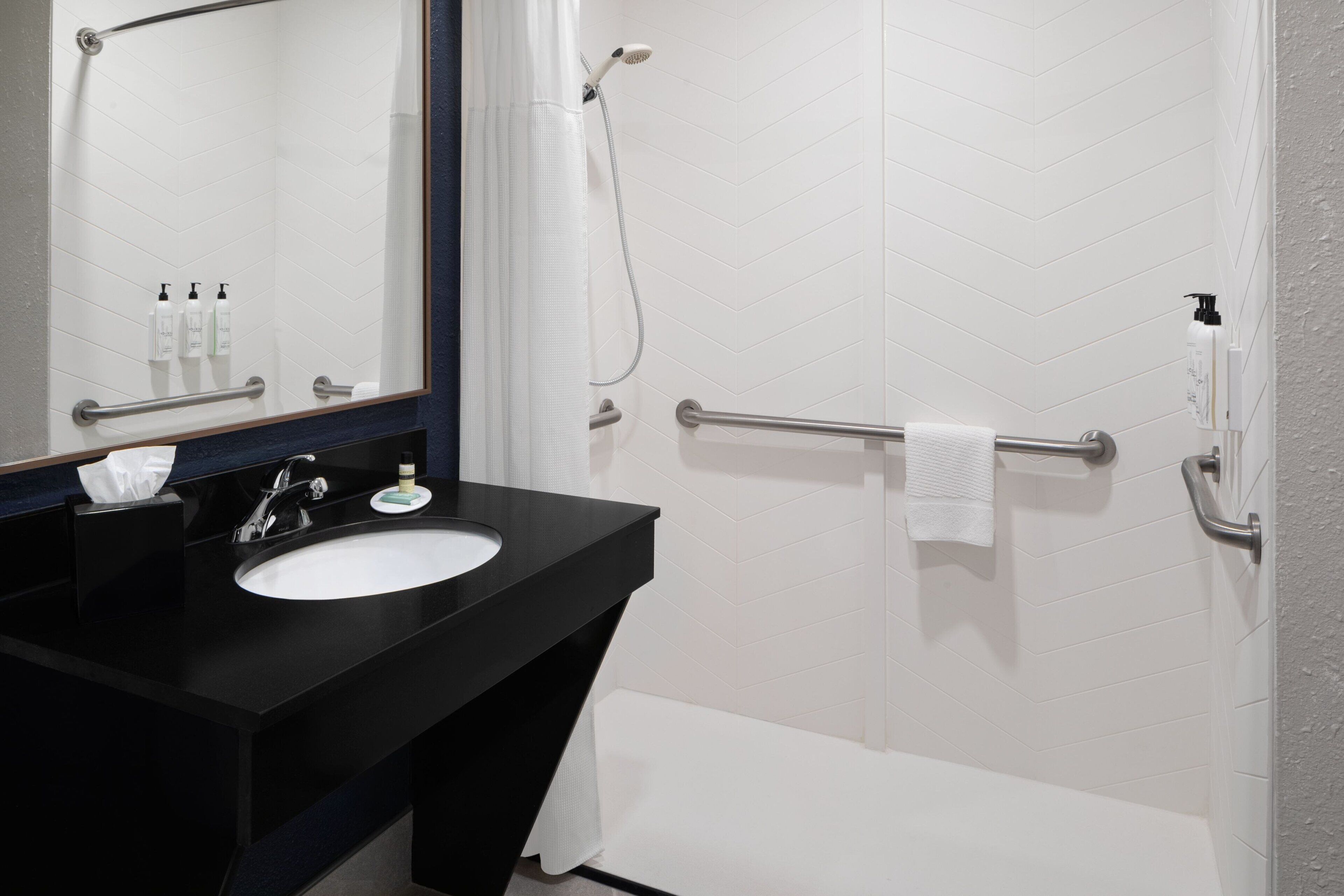 combined shower/bathtub, free toiletries, hair dryer, towels