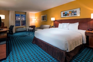 Premium bedding, desk, laptop workspace, iron/ironing board