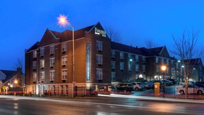 A brick building with a marquee sign reading "Fairfield Inn."