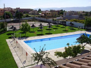 Seasonal outdoor pool, open noon to 8:30 PM, pool umbrellas