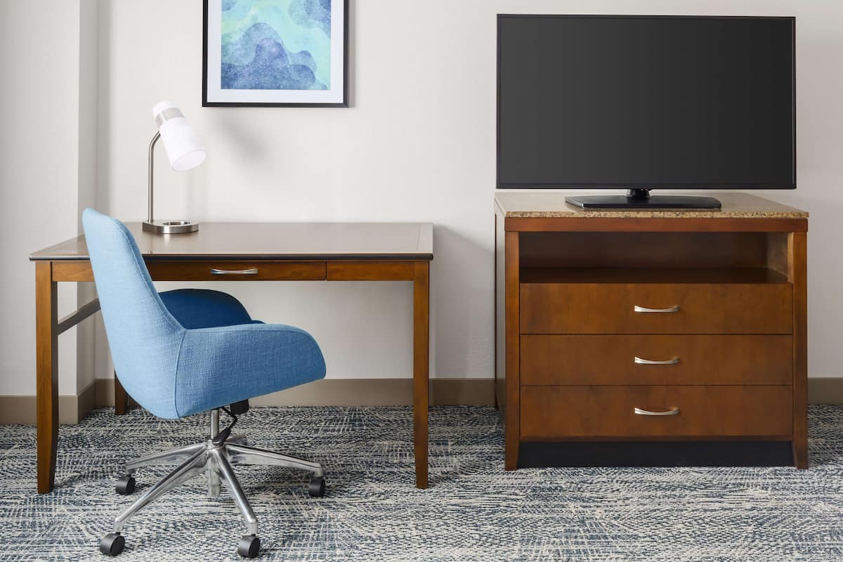 Desk, laptop workspace, blackout drapes, iron/ironing board