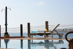 Seasonal outdoor pool, pool umbrellas, sun loungers