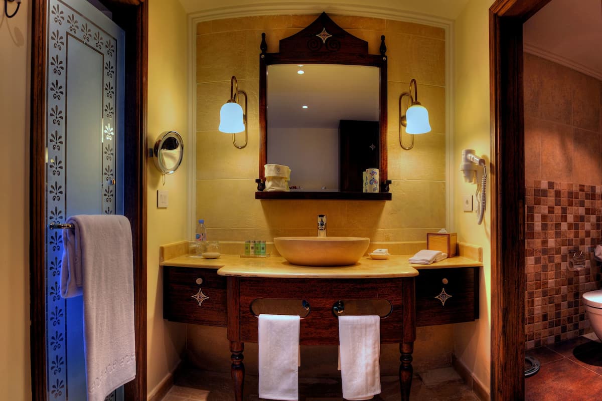 rainfall showerhead, designer toiletries, hair dryer, bathrobes