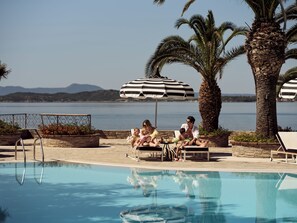 Indoor pool, seasonal outdoor pool, pool umbrellas, pool loungers