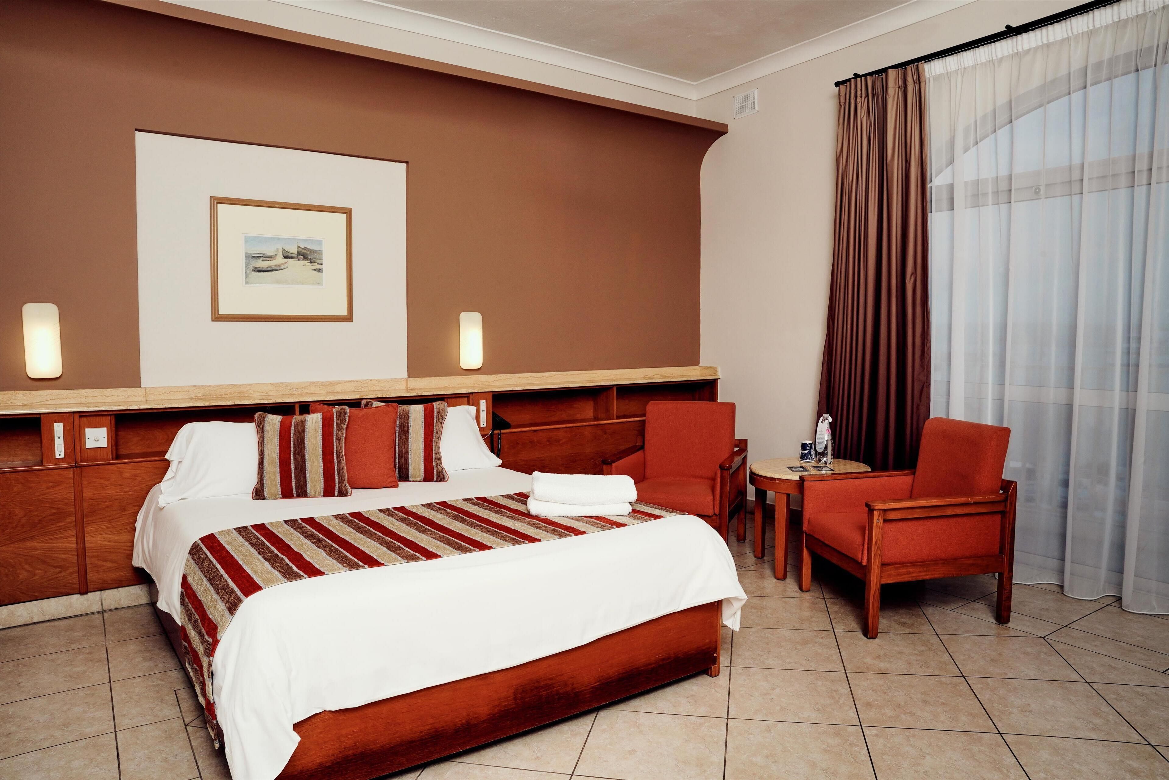 Double or Twin Room, Sea View | Minibar, in-room safe, desk, blackout drapes