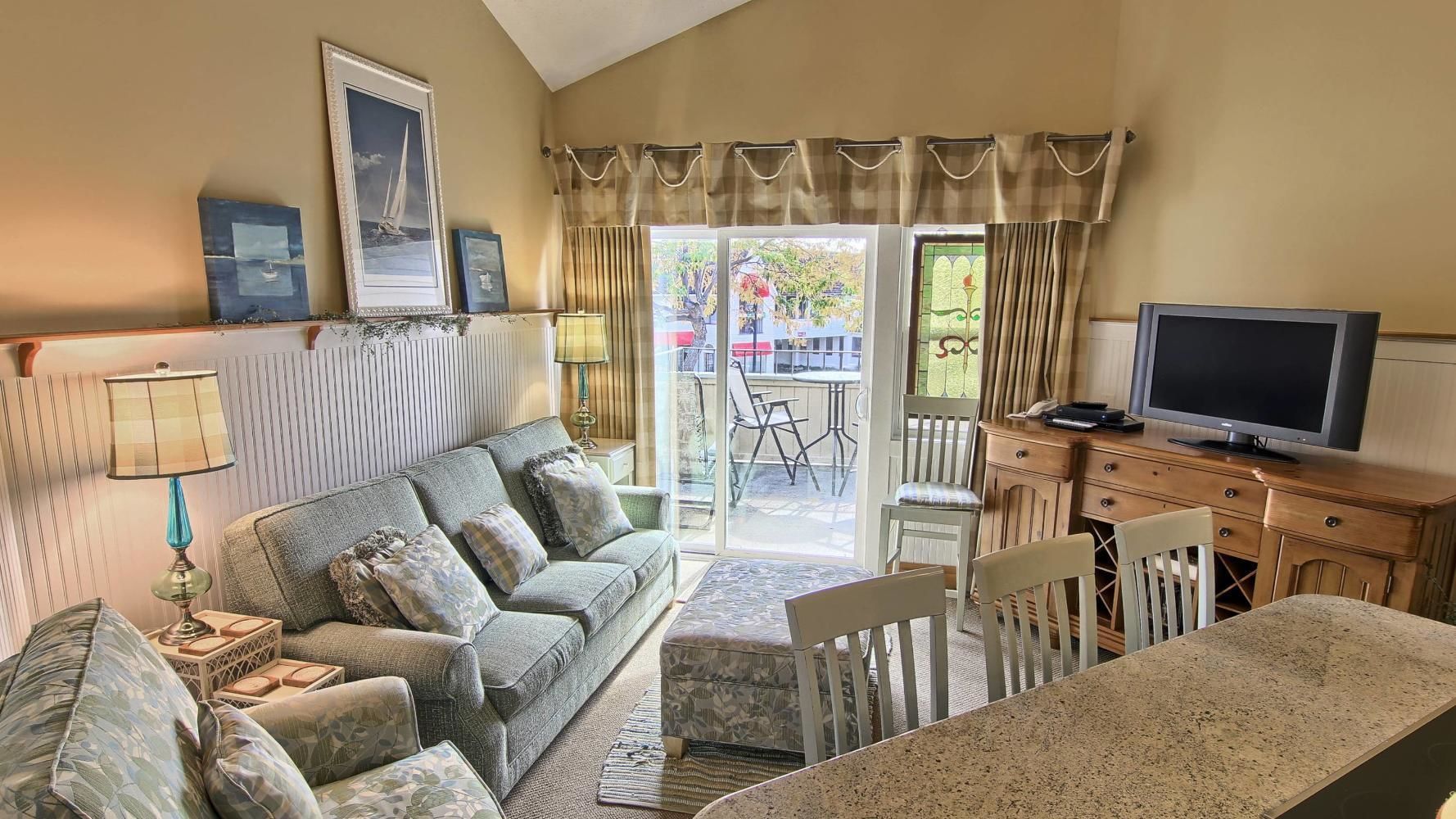 Grand Condo, 2 Bedrooms | Living area | Flat-screen TV