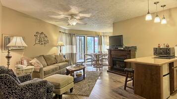 Deluxe Condo, 1 Bedroom (1 King and 1 Sofa Sleeper) | Living room | Flat-screen TV
