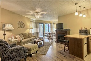 Deluxe Condo, 1 Bedroom (1 King and 1 Sofa Sleeper) | Living room | Flat-screen TV