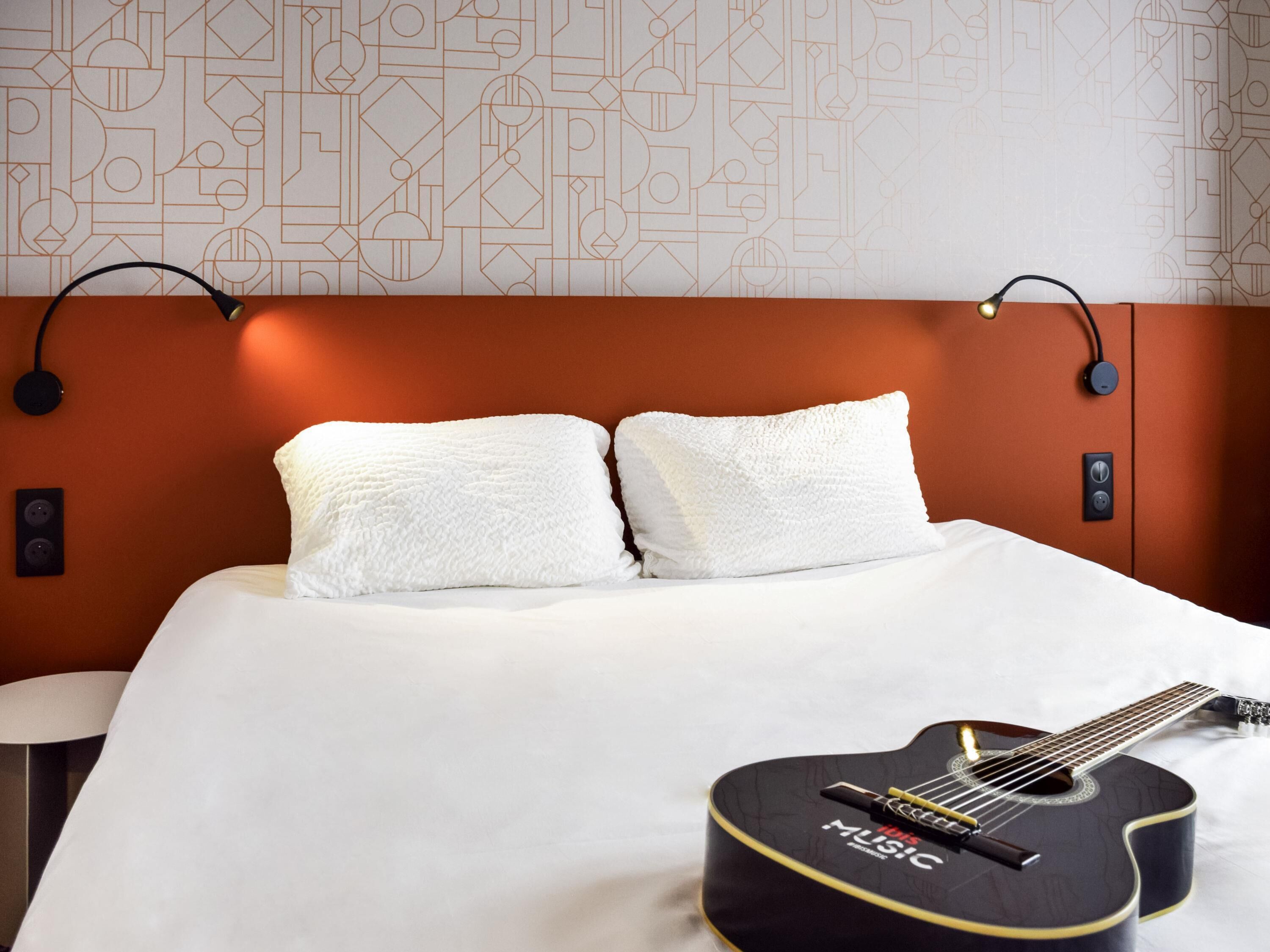 Premium bedding, desk, laptop workspace, blackout drapes